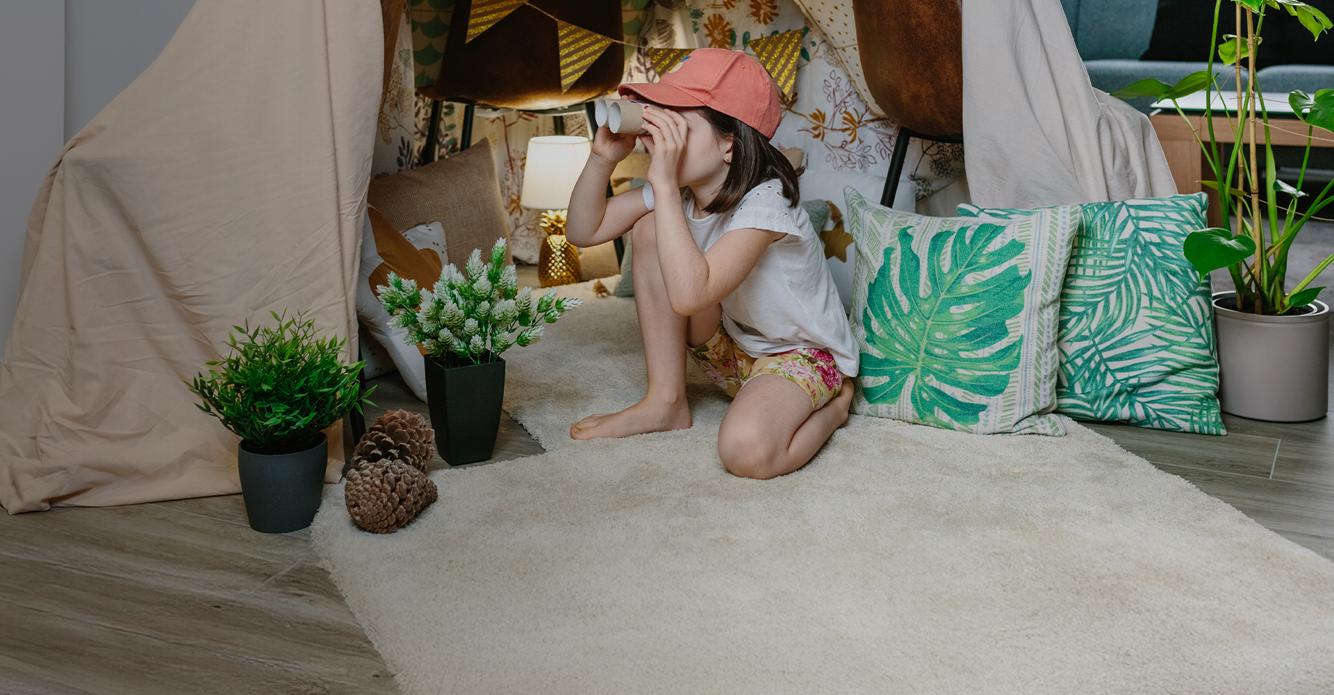 Child playing on hardwood floor.